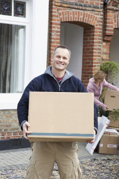 Furniture pick-up team handling bulky items in a Camdentown street