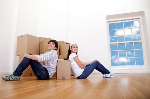 Moving team planning a home move in Camdentown on a residential street